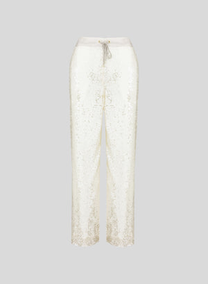 PANTALONI IN RETE E MICROPAILLETTES