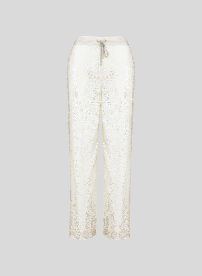 PANTALONI IN RETE E MICROPAILLETTES