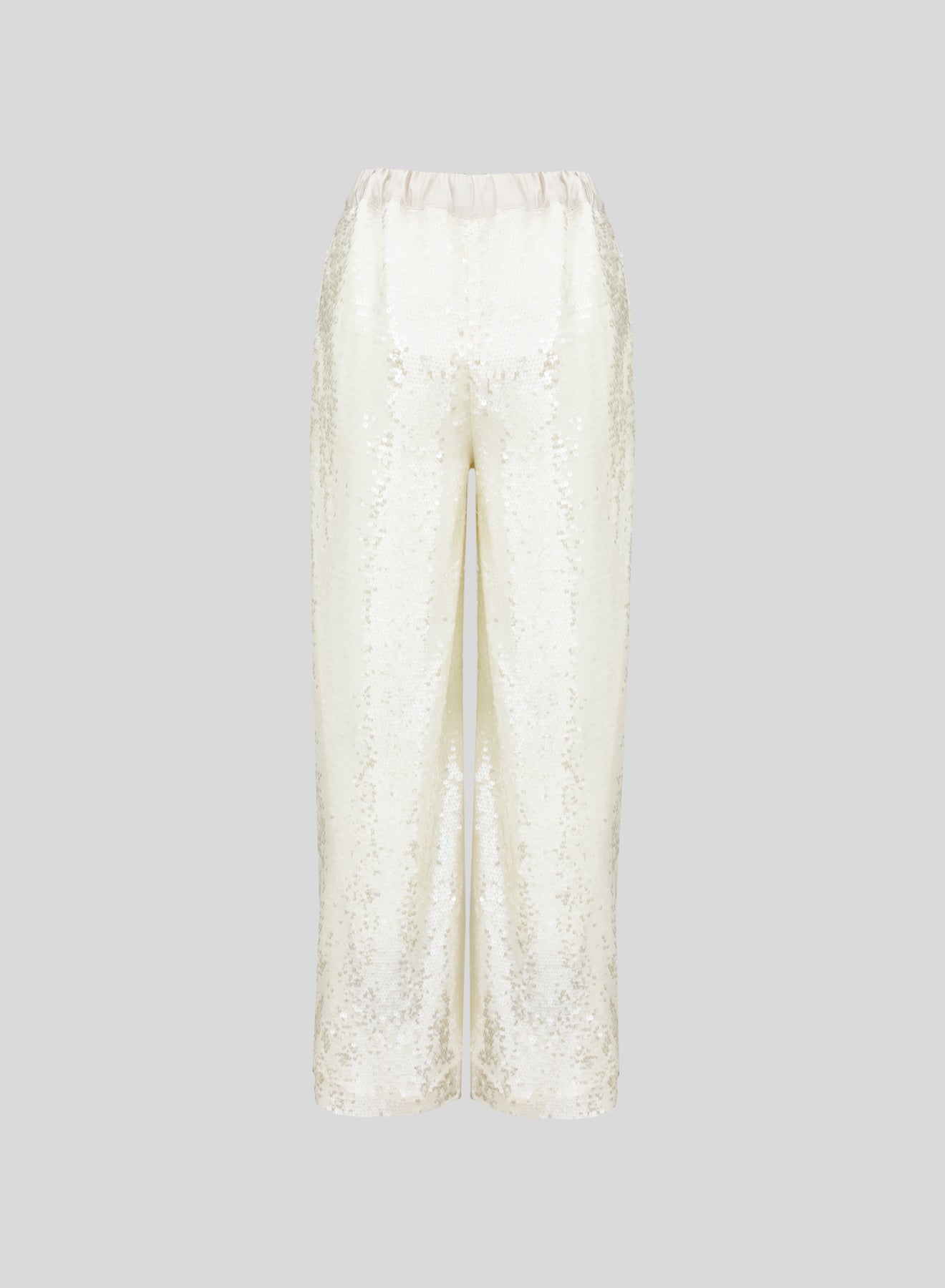 PANTALONI IN RETE E MICROPAILLETTES