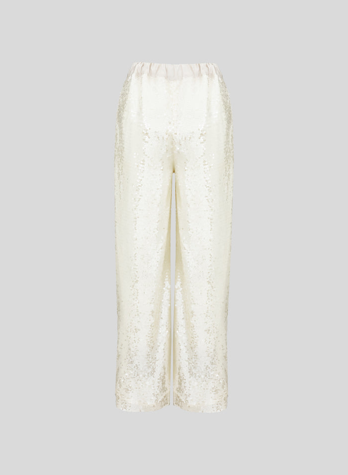 PANTALONI IN RETE E MICROPAILLETTES