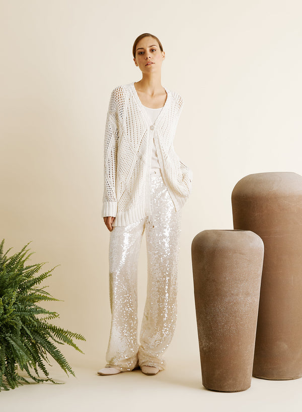 PANTALONI IN RETE E MICROPAILLETTES