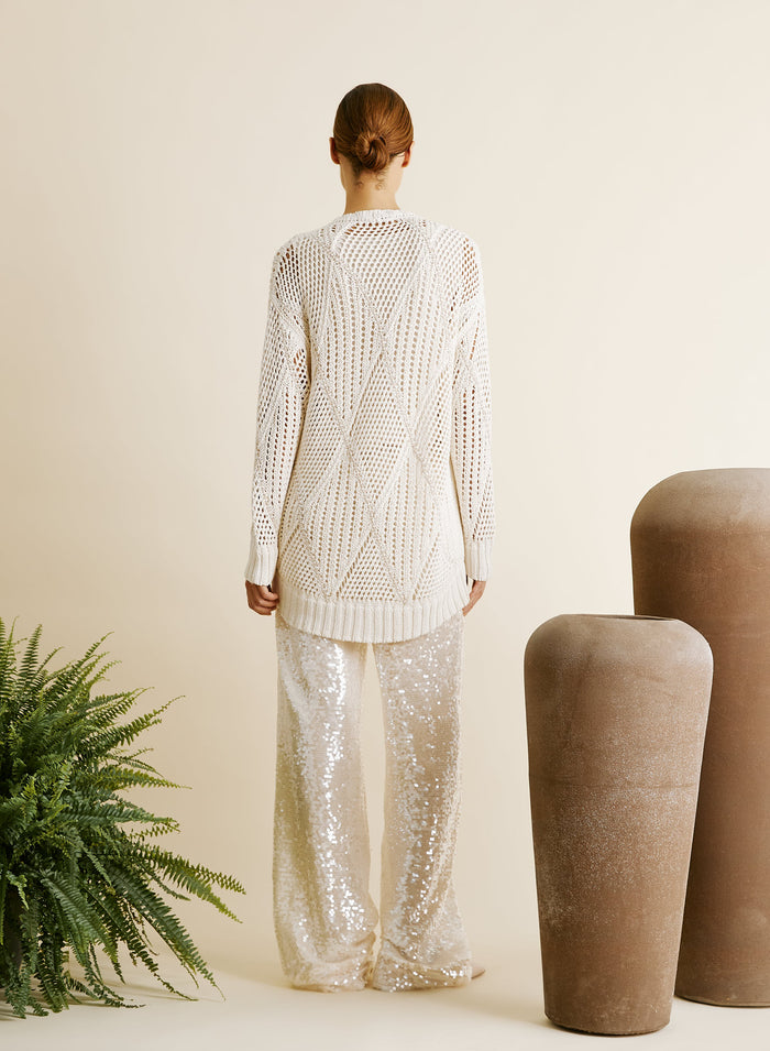 PANTALONI IN RETE E MICROPAILLETTES
